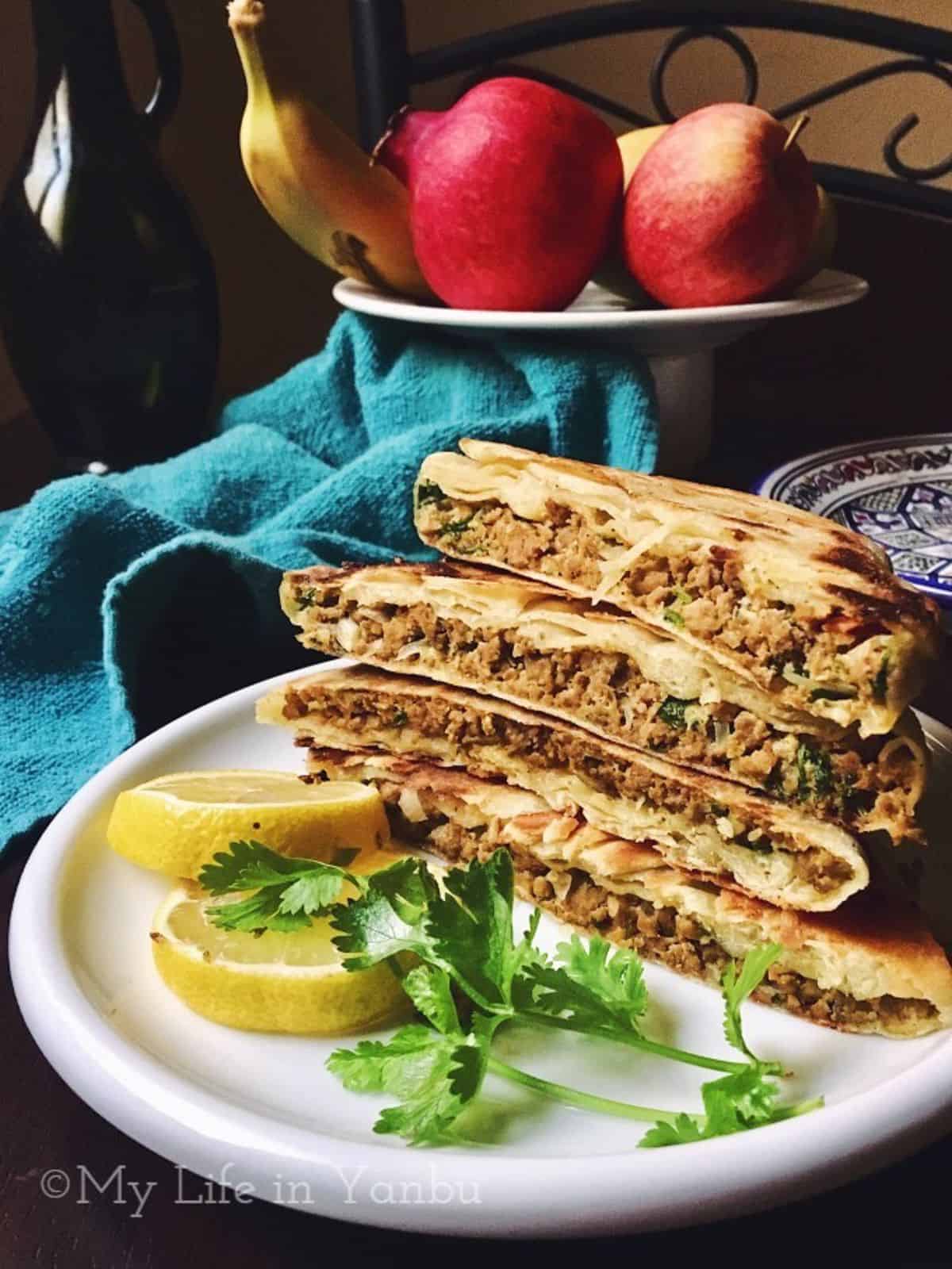 a stack of half sliced murtabaq