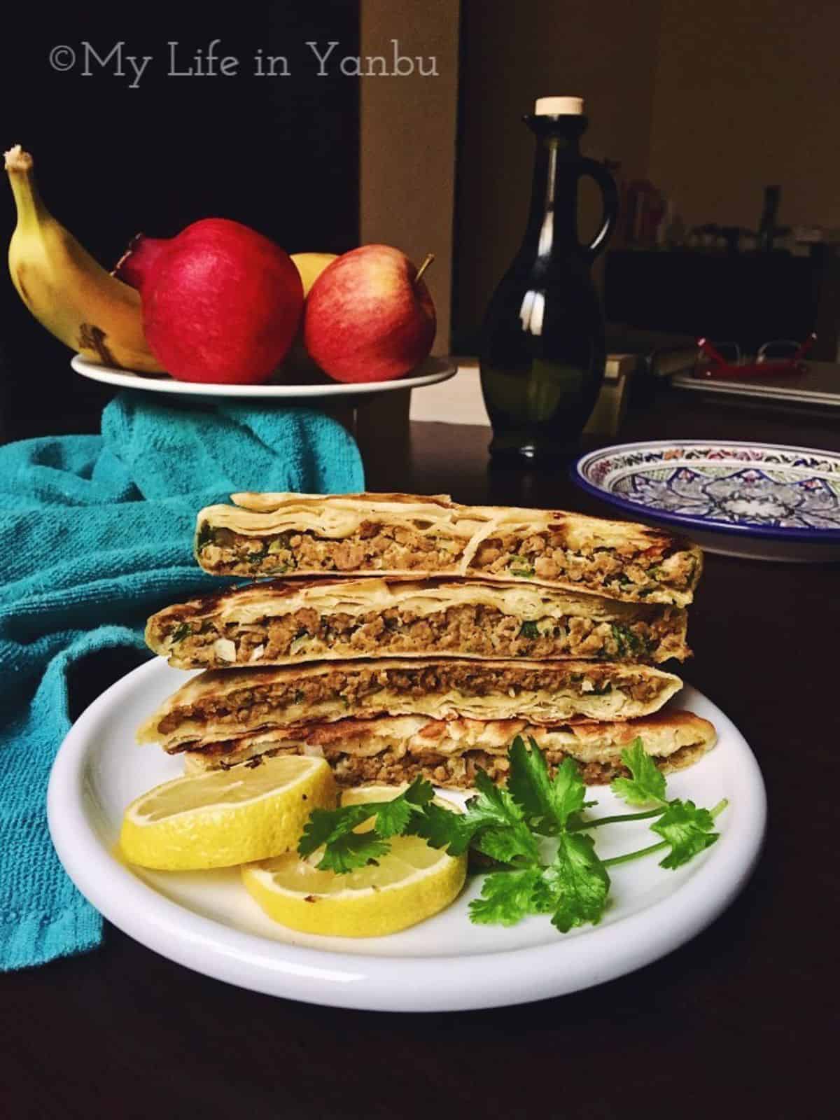 a stack of sliced mutaabaq