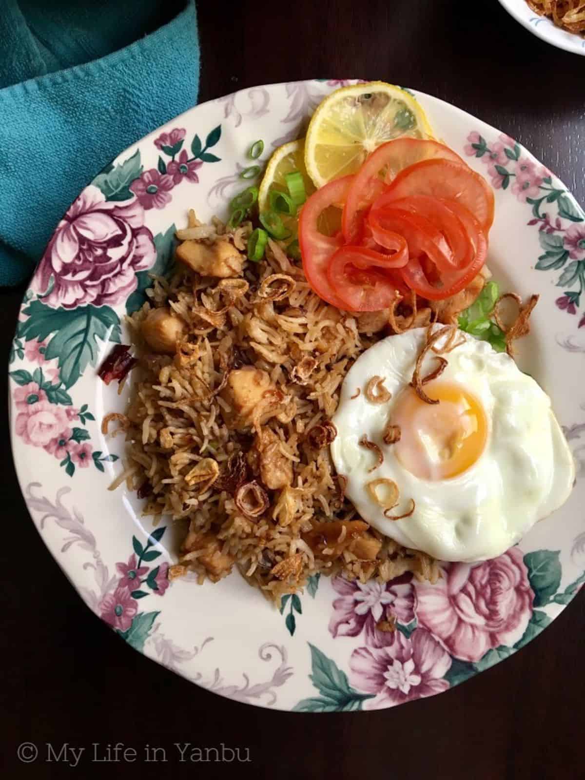 nasi goreng served with fried egg