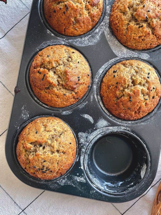 ripe plantain muffins still in the muffin tray with one empty hole