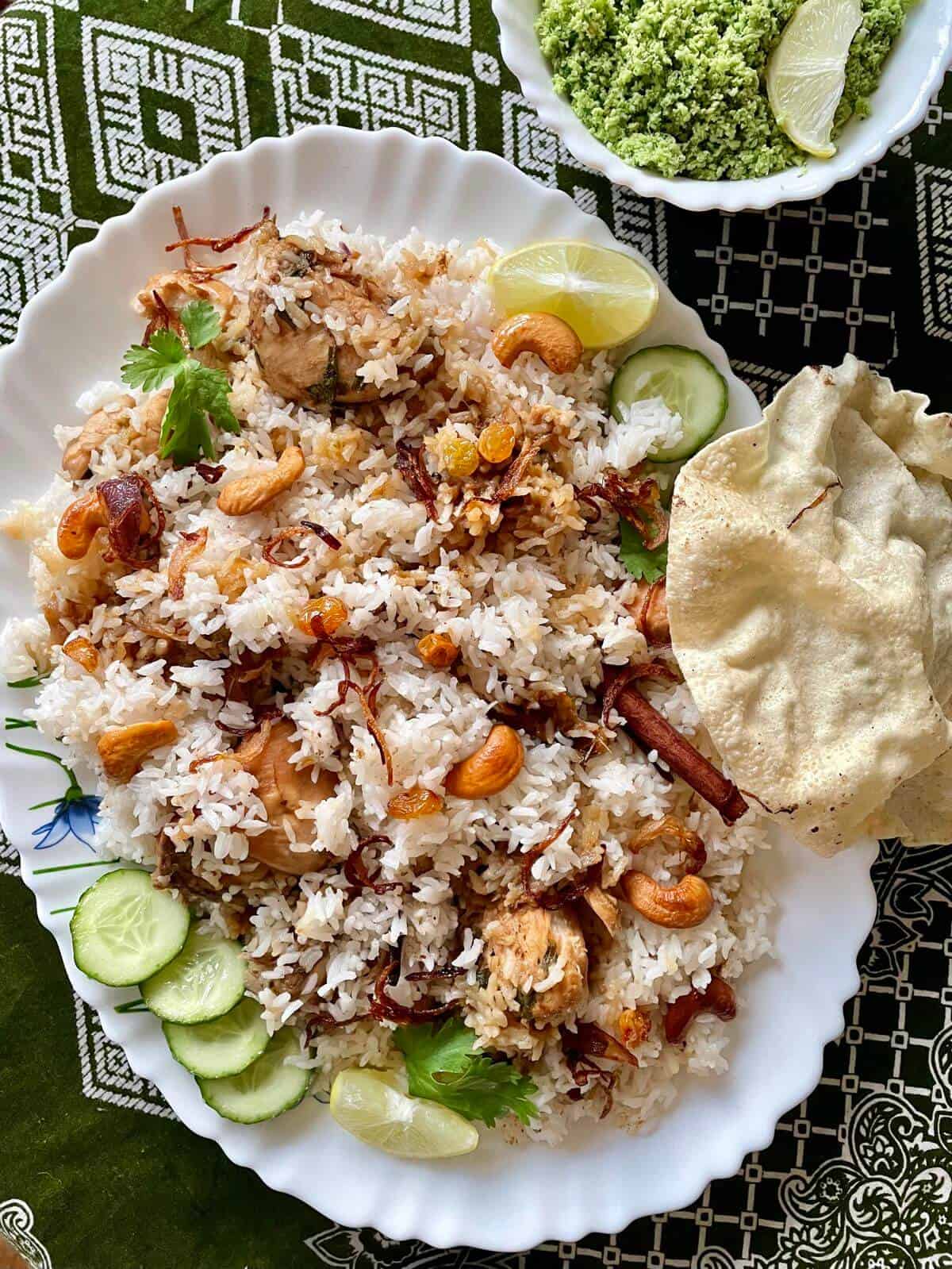 Thalassery biriyani served in a platter with salad