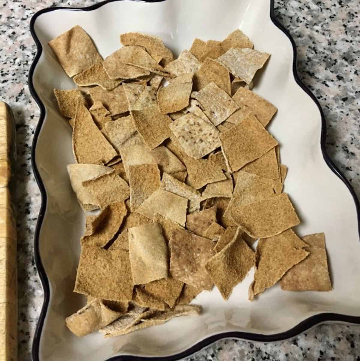 toasted pita pieces on bottom of the casserole dish