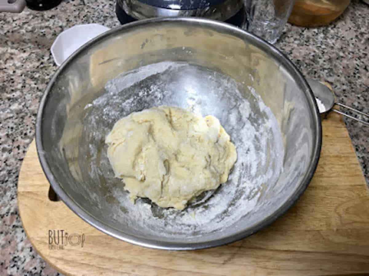 a rough dough in a bowl.