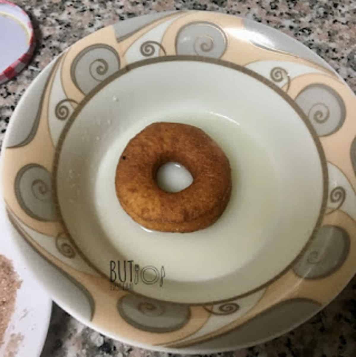 donut dunked in glaze.