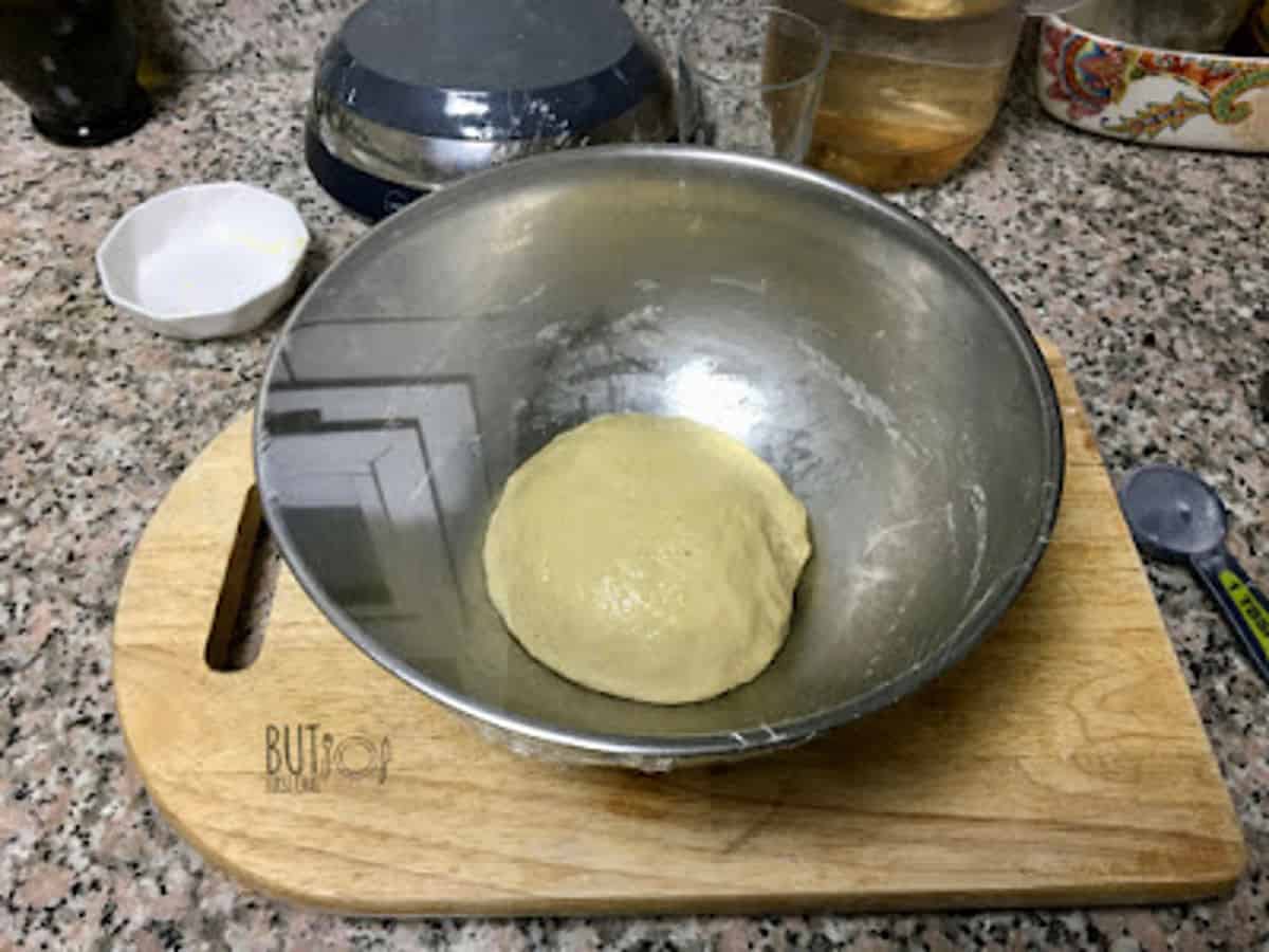 greased dough in a greased bowl.