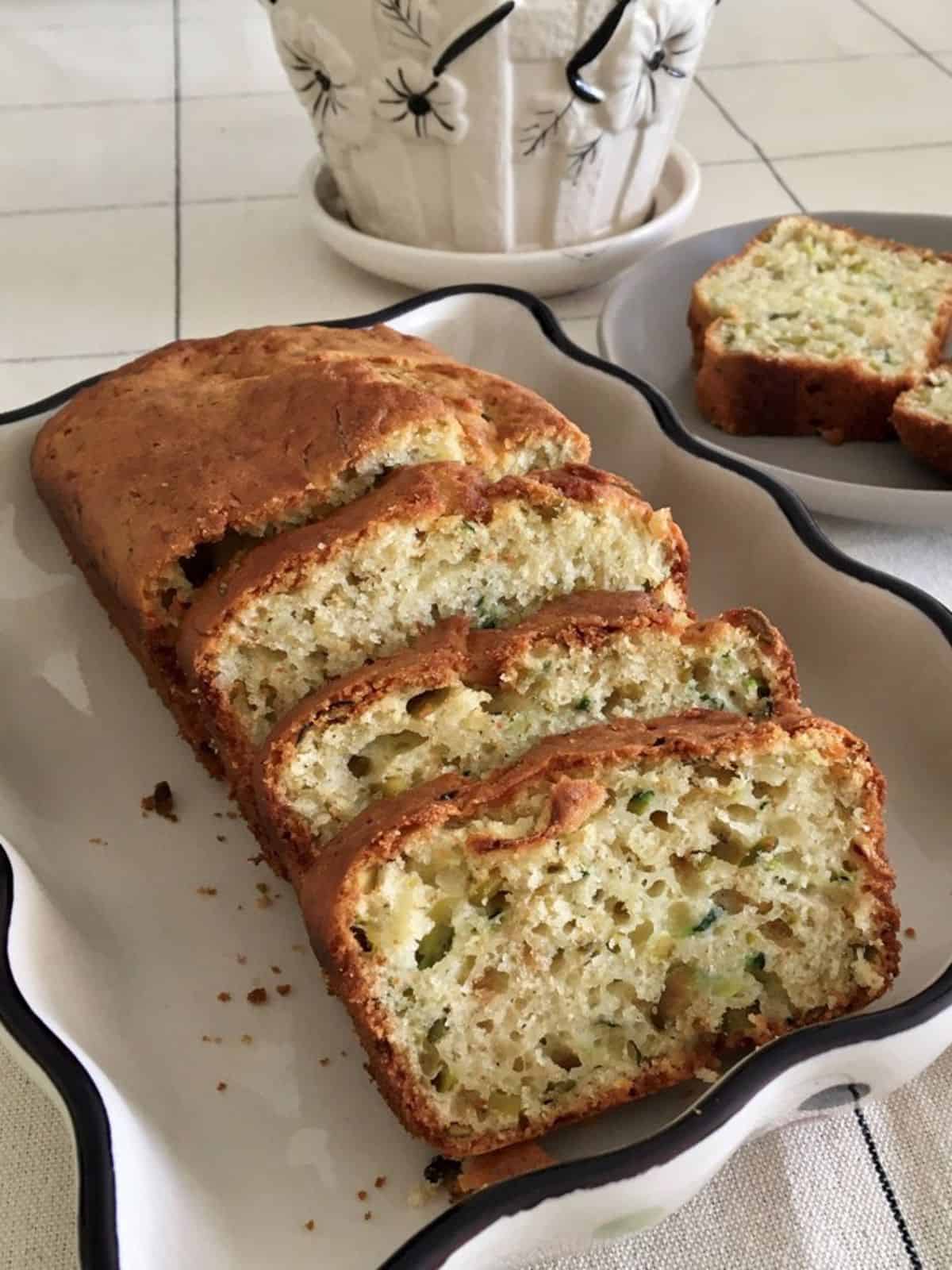 A loaf of zucchini bread sliced and served