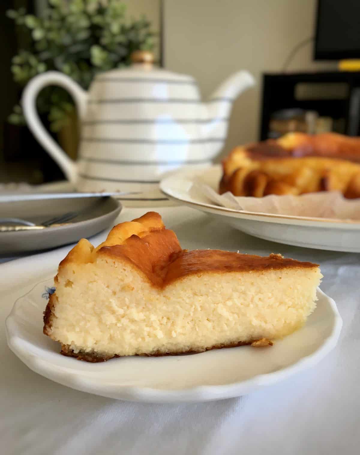 a side view of a slice of burnt cheesecake