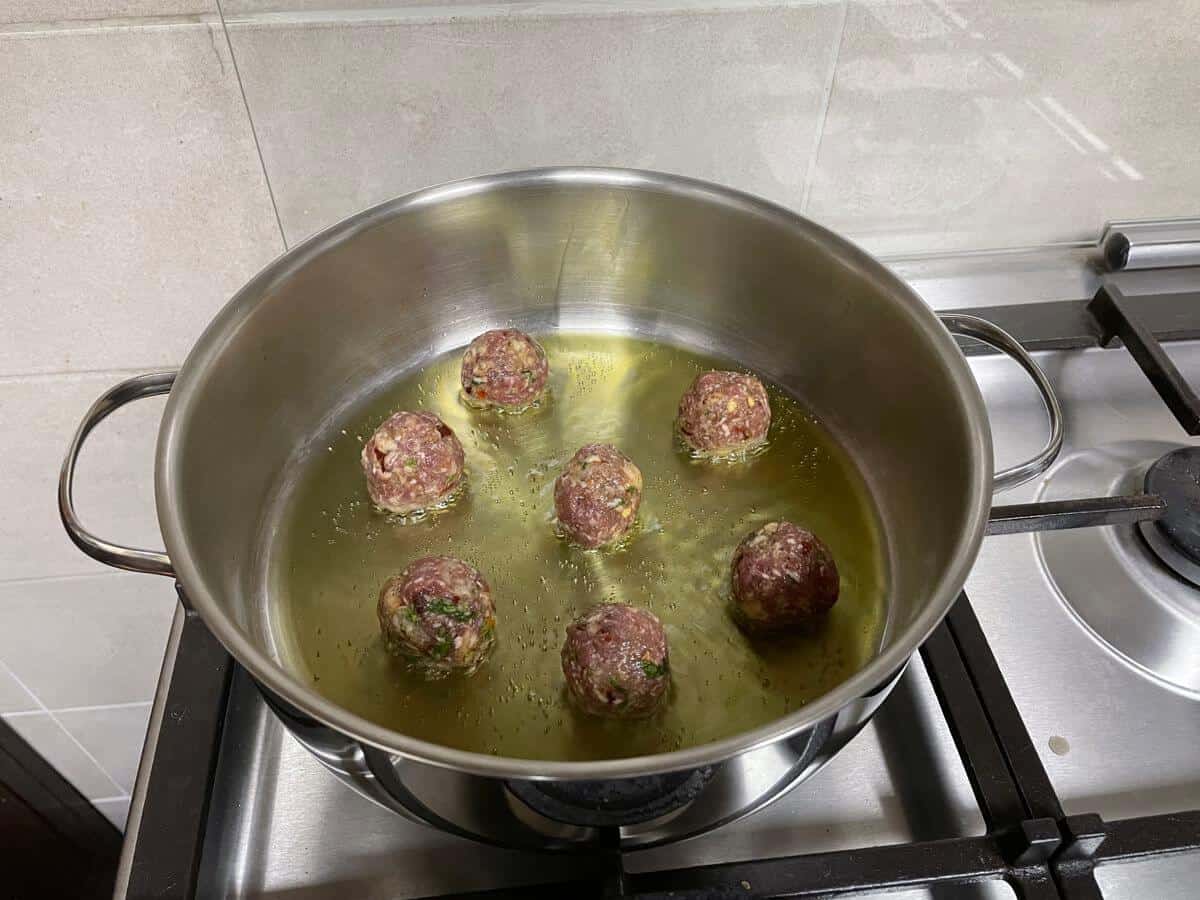 searing meatballs in small batches in olive oil