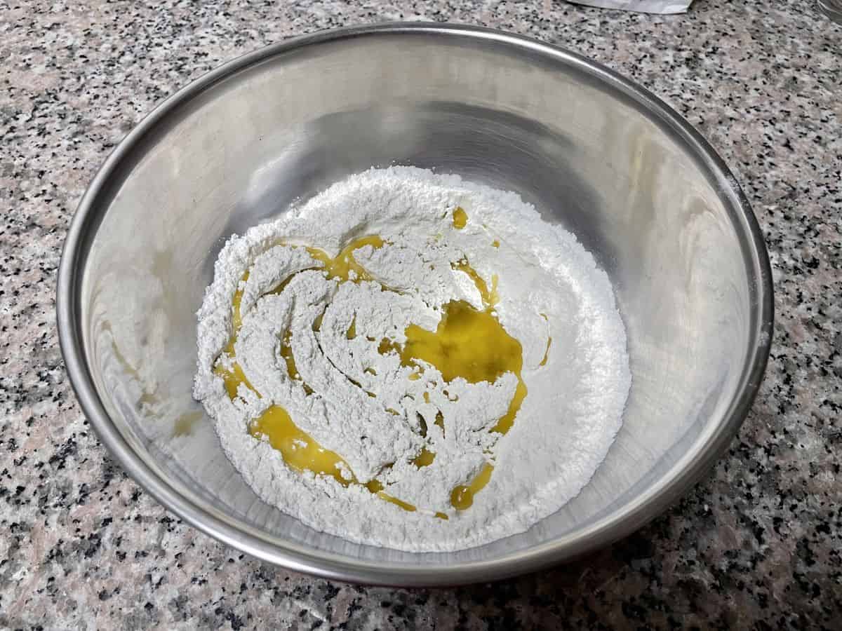 olive oil drizzled over the flour