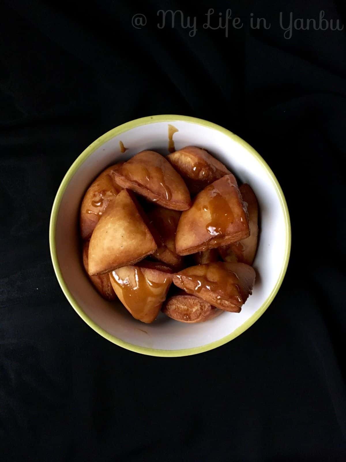 a bowl of fried mandazi