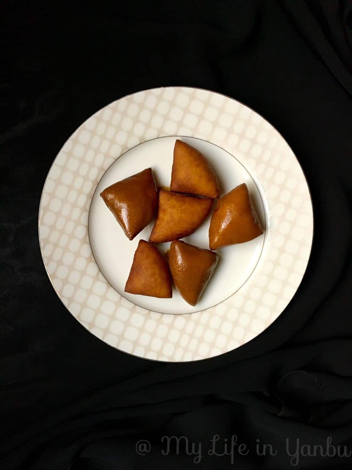 a plate of fried mandazi