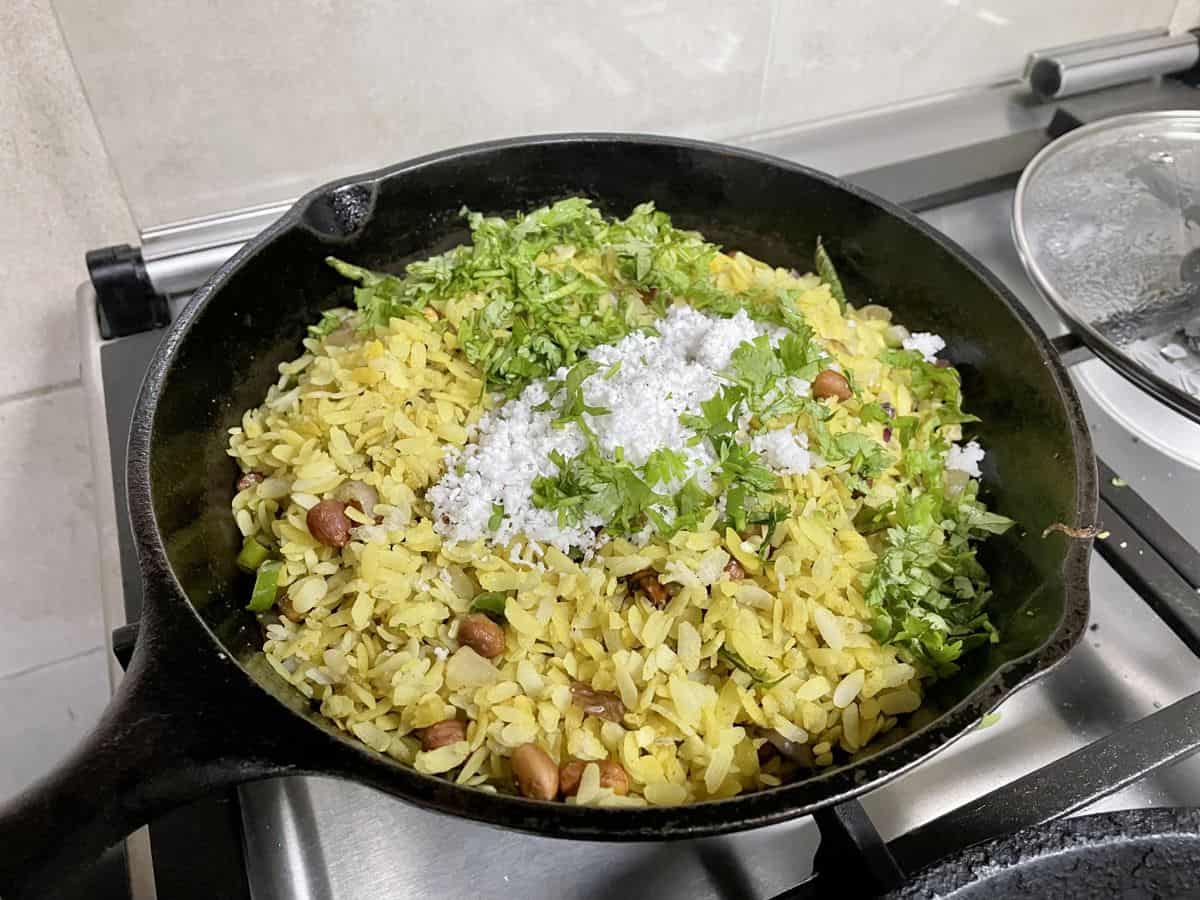 kanda poha finished off with grated coconut and coriander leaves.