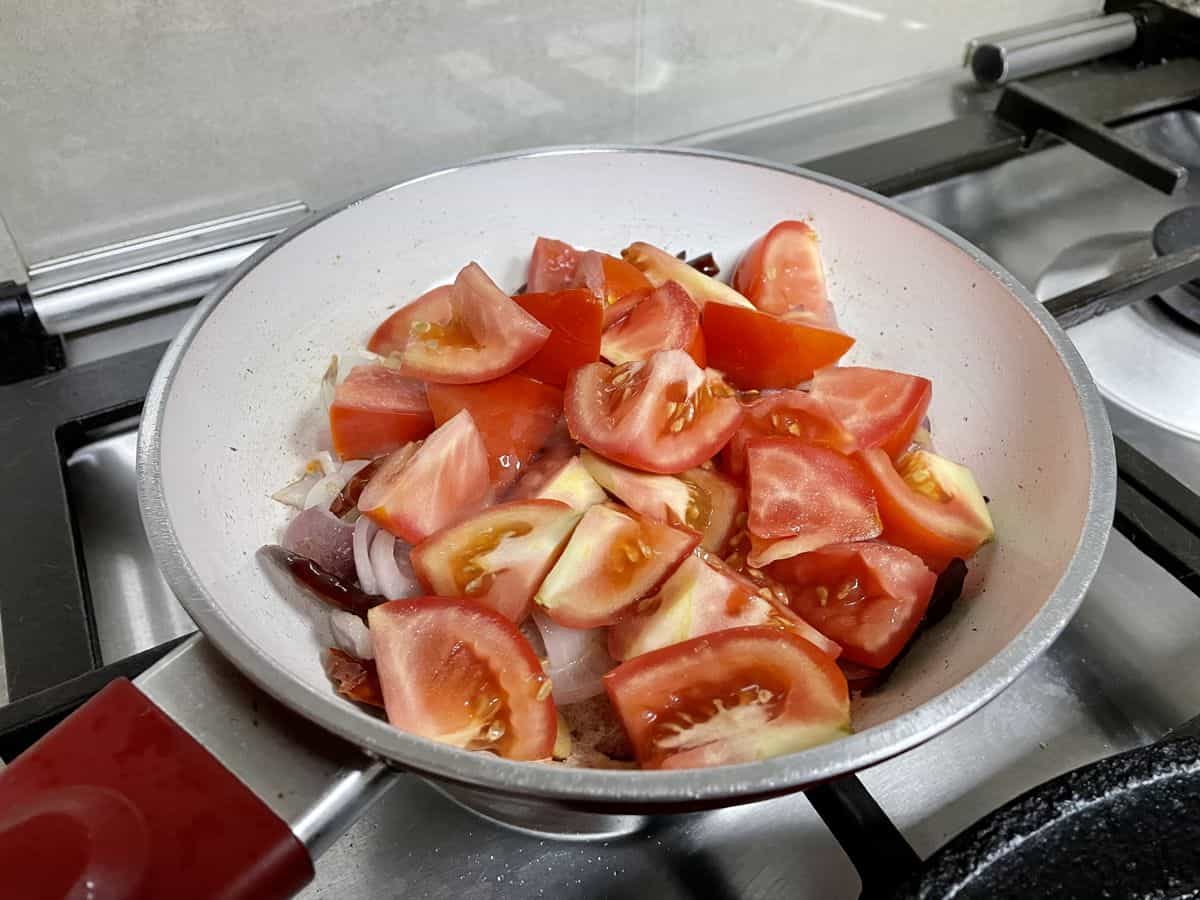 Roughly chopped ripe tomatoes with sauteed aromatics. 