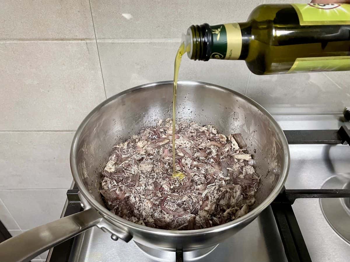 A thin stream of olive oil