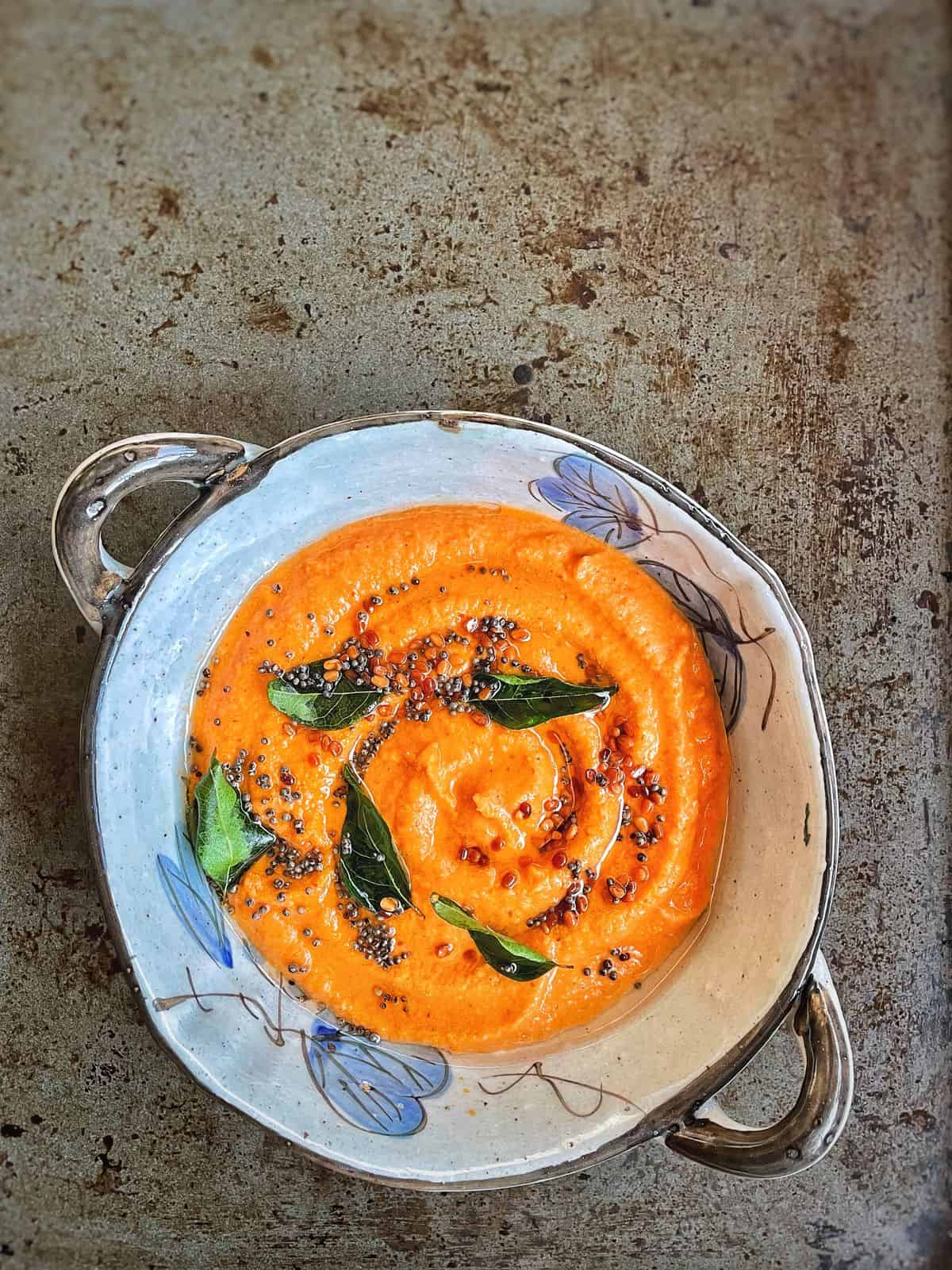 a bowl of tomato coconut chutney