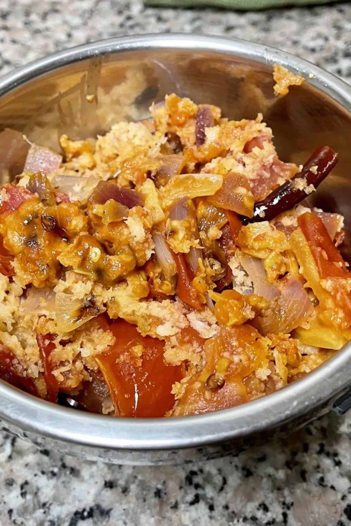 Sauteed coconut tomato chutney ingredients in a mini blender