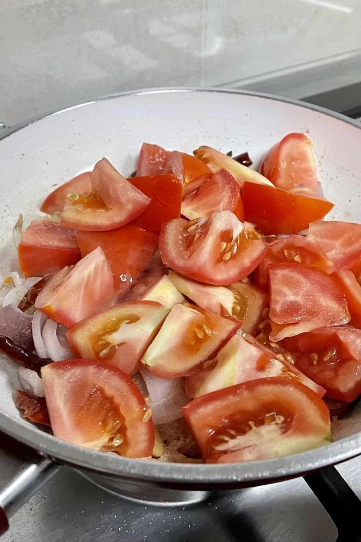 Roughly chopped ripe tomatoes with sauteed aromatics.