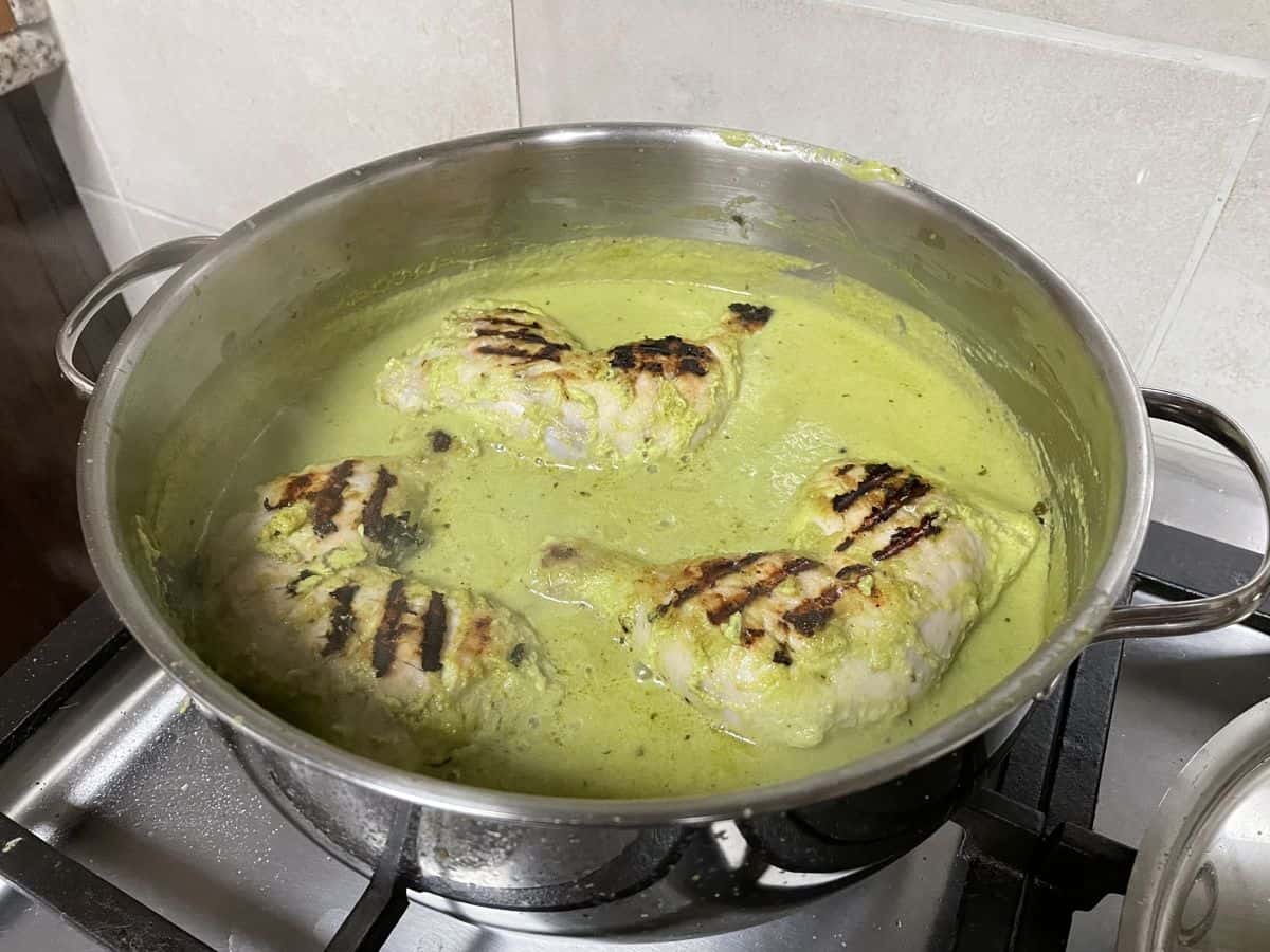 Afghani chicken curry boiling