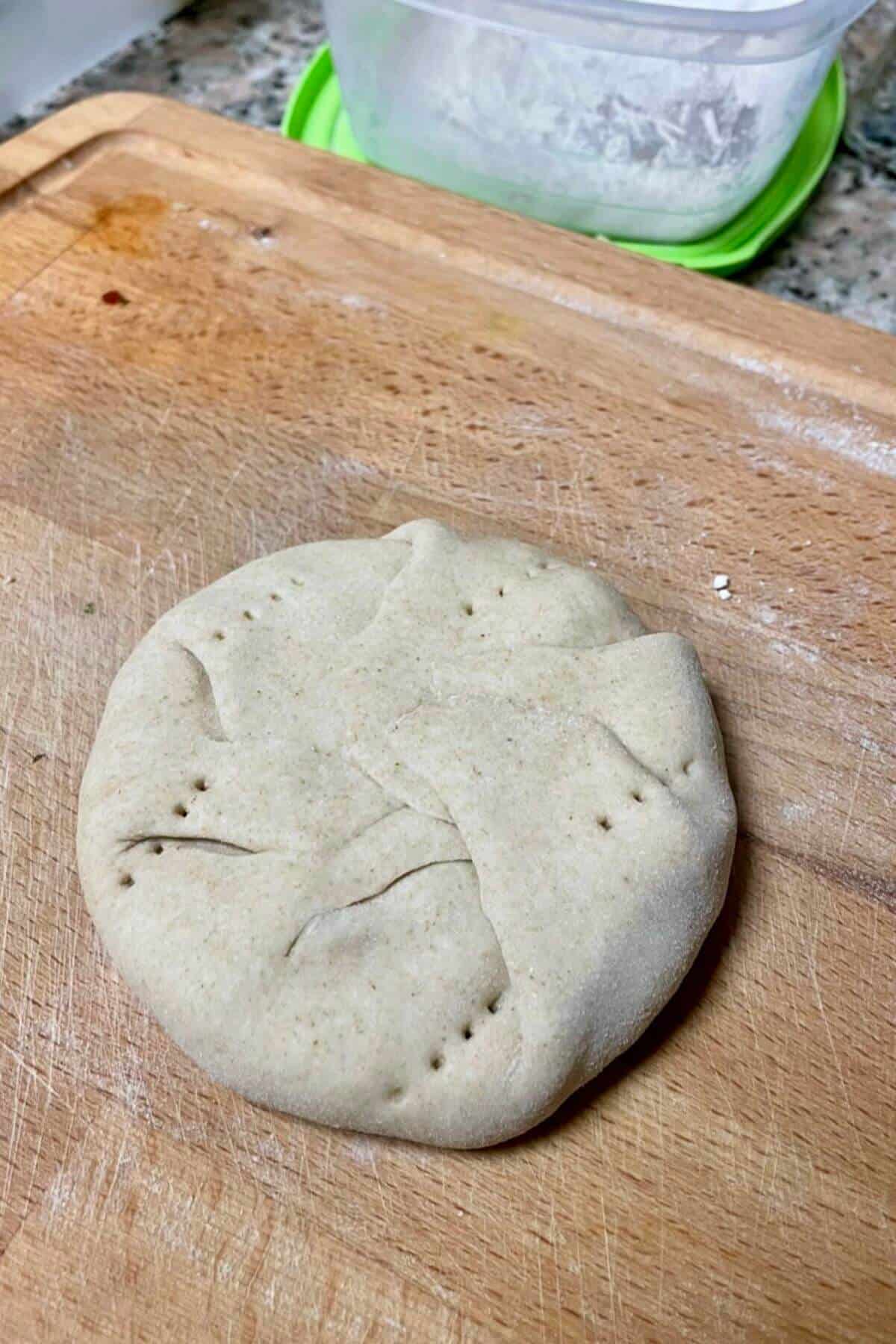 Poked holes int stuffed dough to release trapped air.