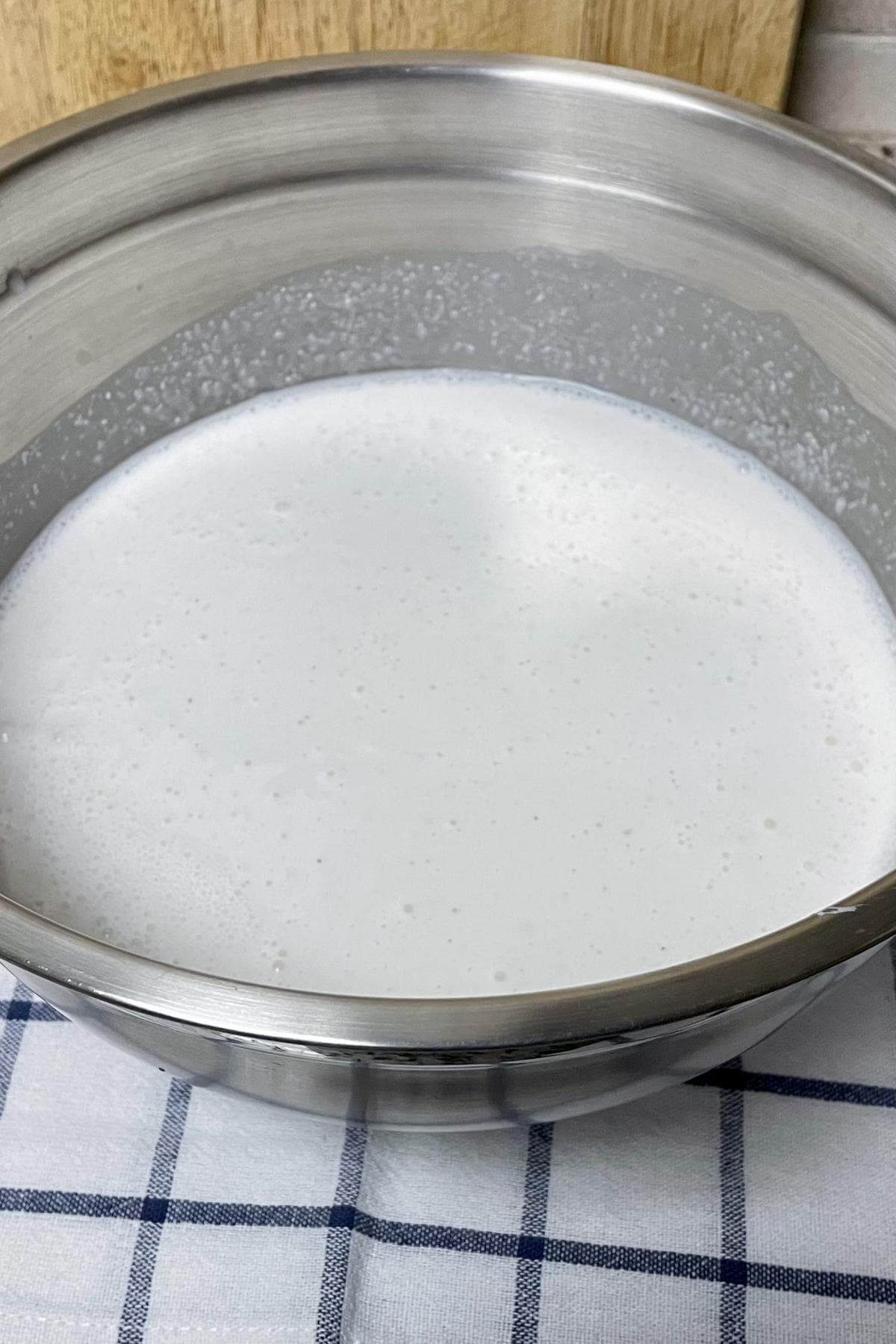 A bowl of rice batter sitting on a counter.