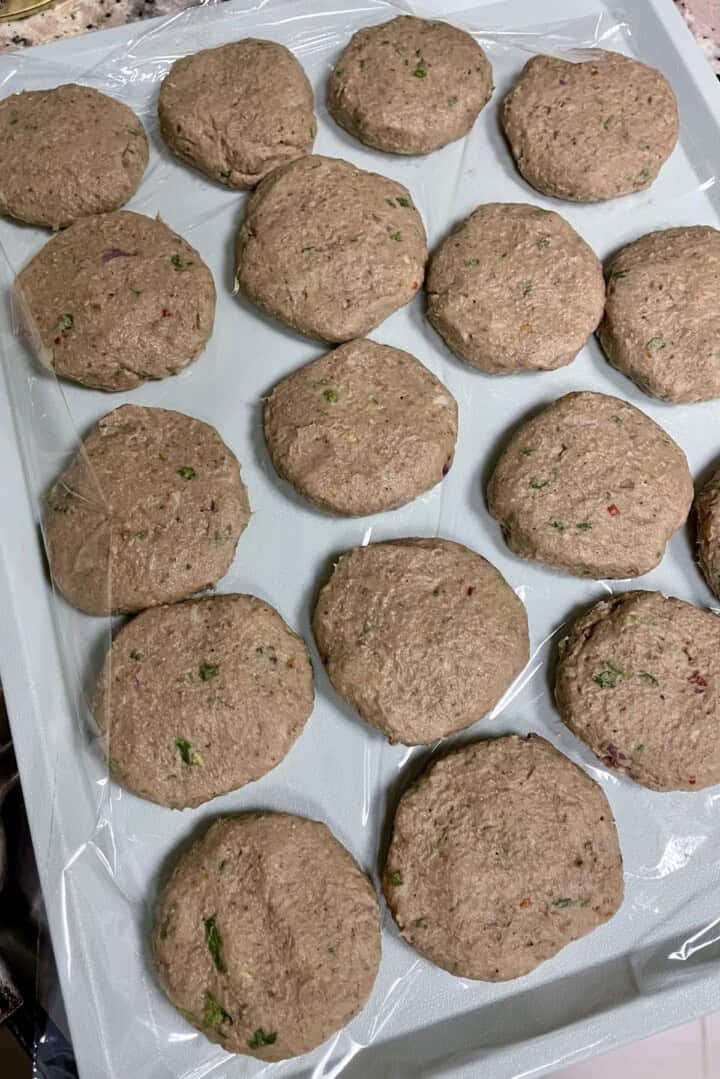 A tray of shami patties on top of a counter.