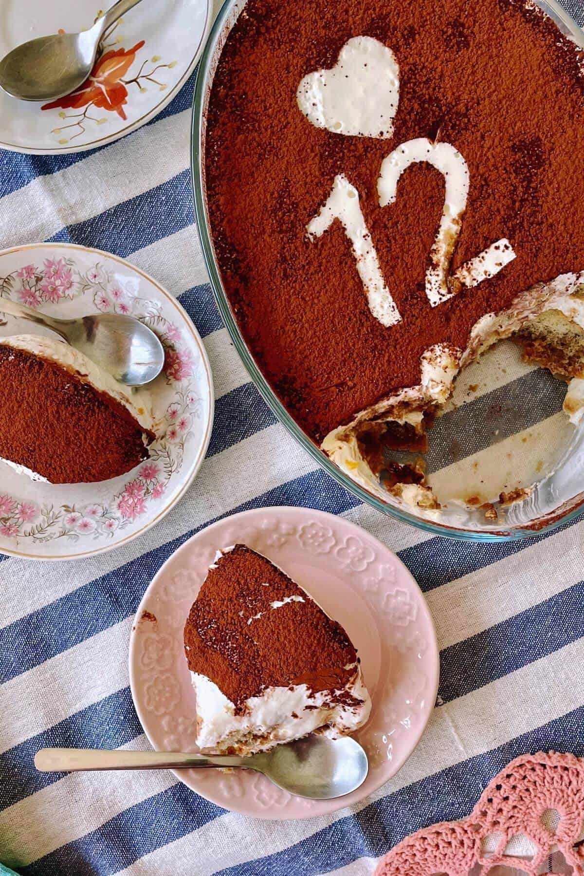 Chilled tiramisu dessert, scooped and served in two plates.