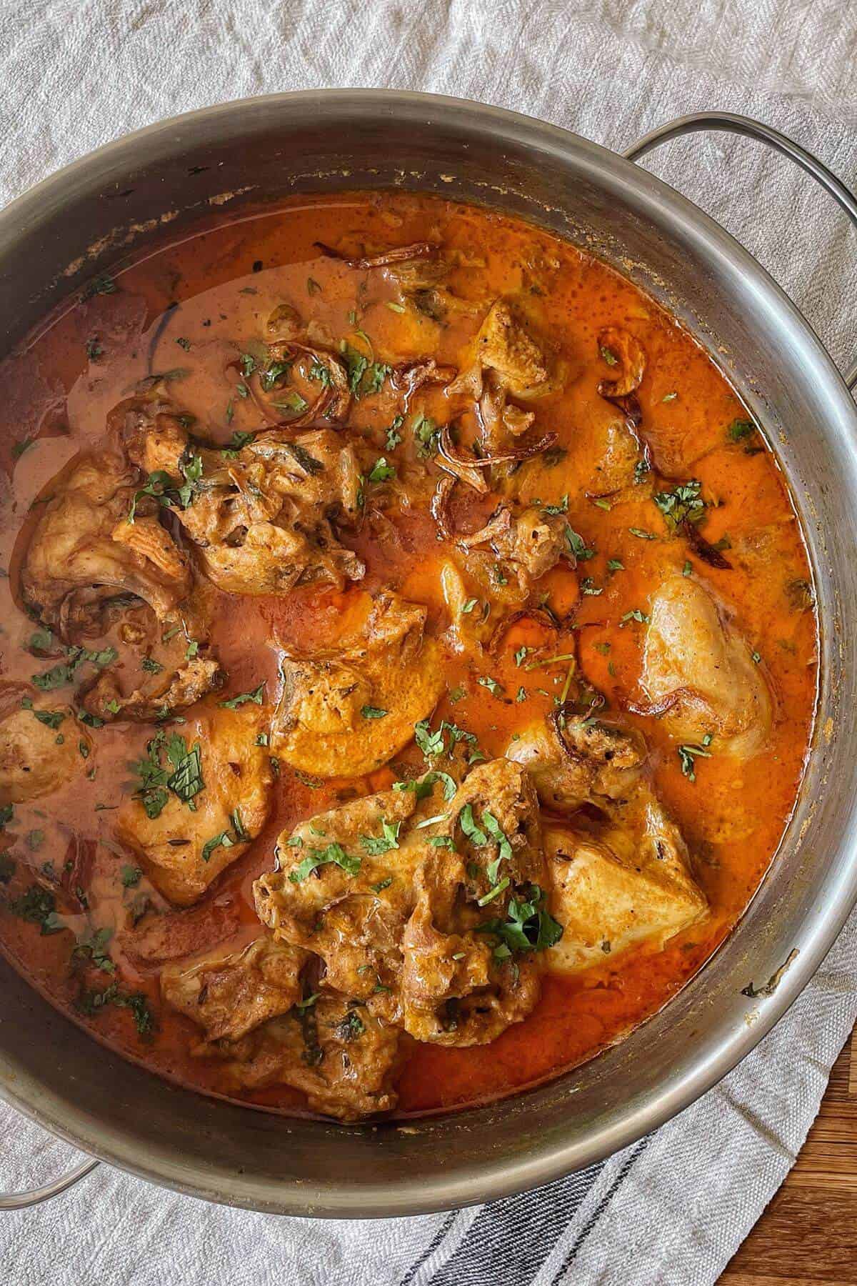 A saucepot of chicken hyderabadi curry.