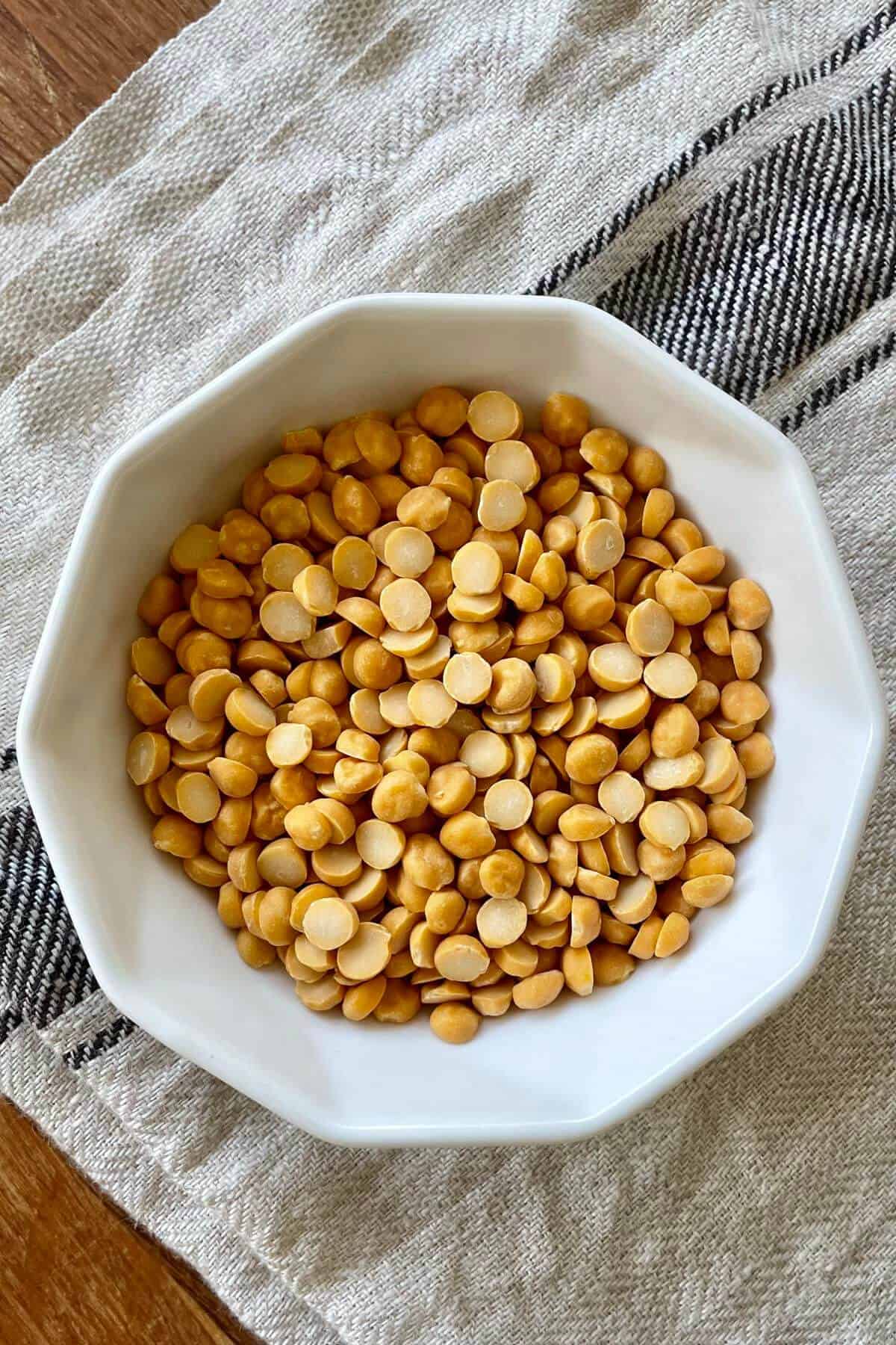 A small bowl of raw chana dal known as split bengal gram.