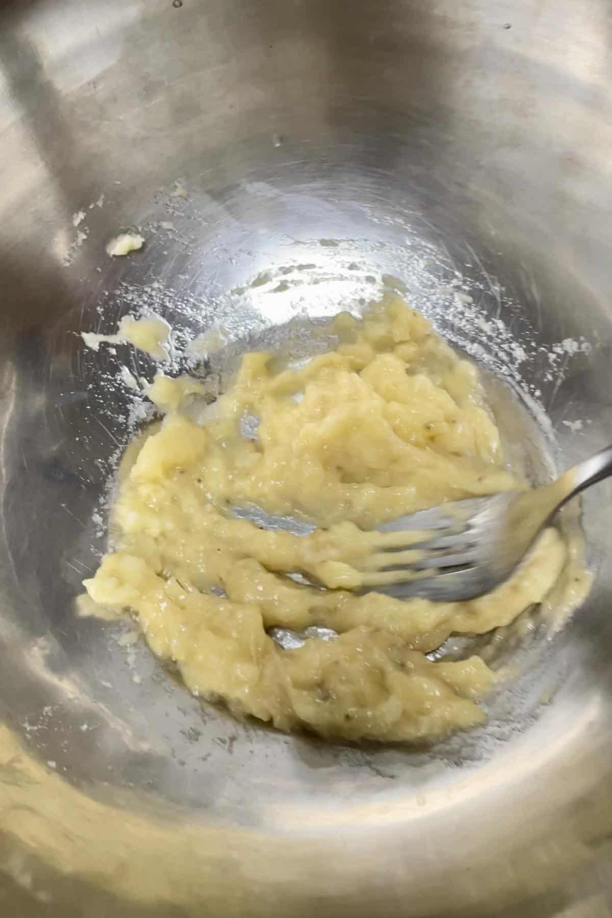 Mashing overripe banana