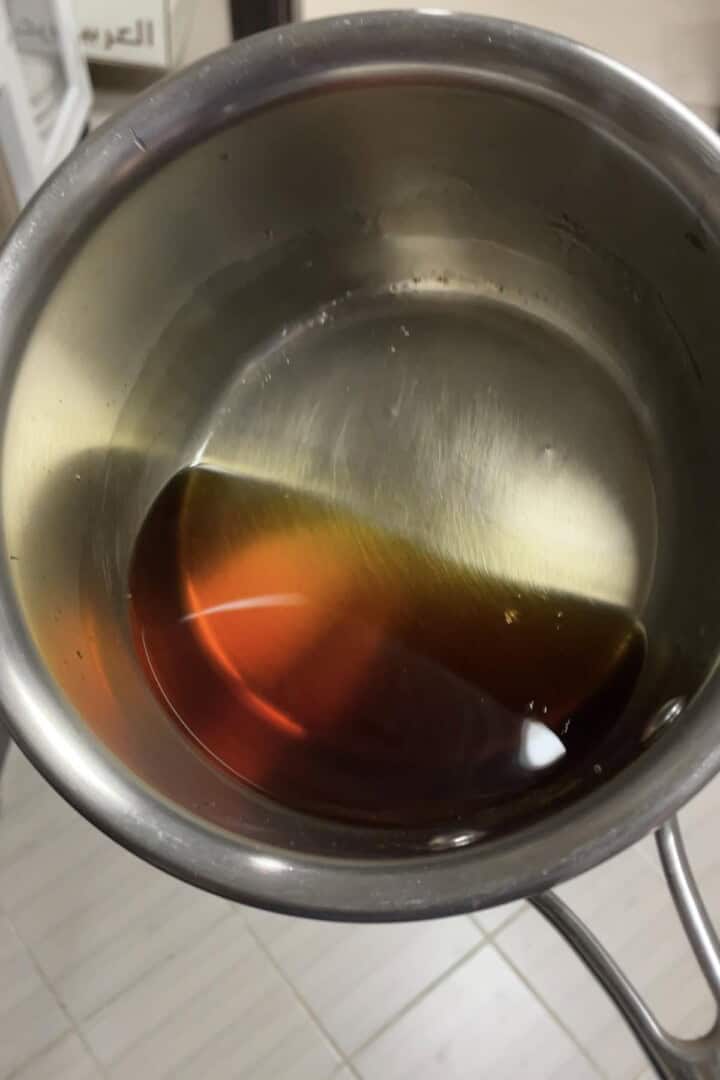 A saucepan freshly prepated caramel syrup