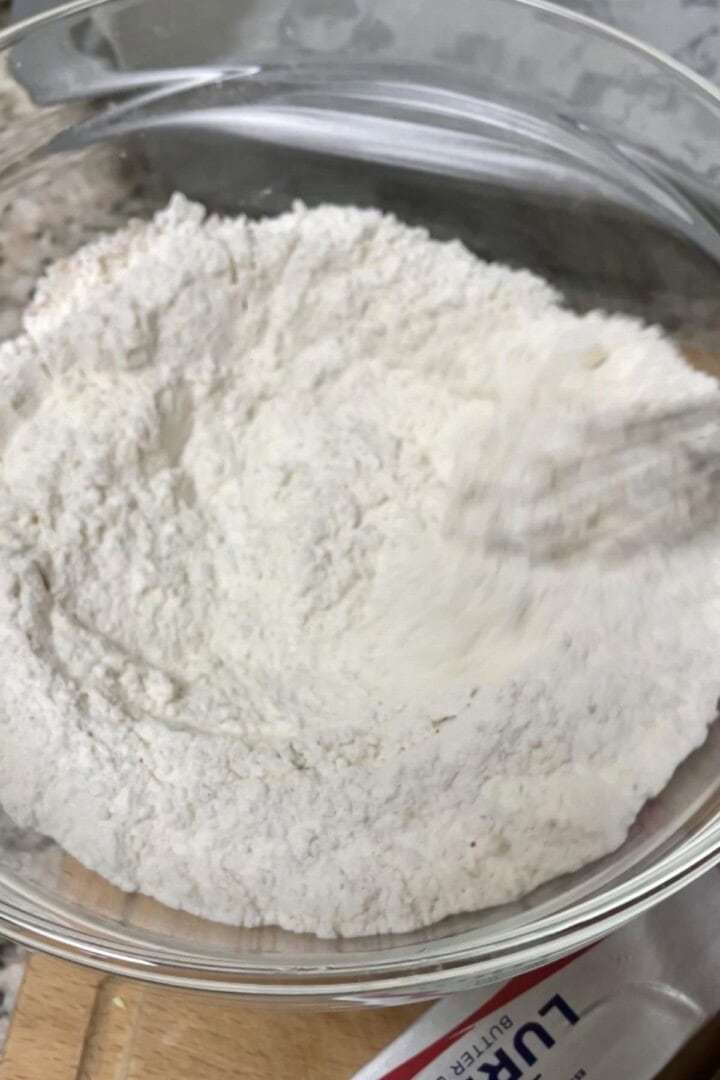 A bowl dry flour ingredients for kerala plum cake.