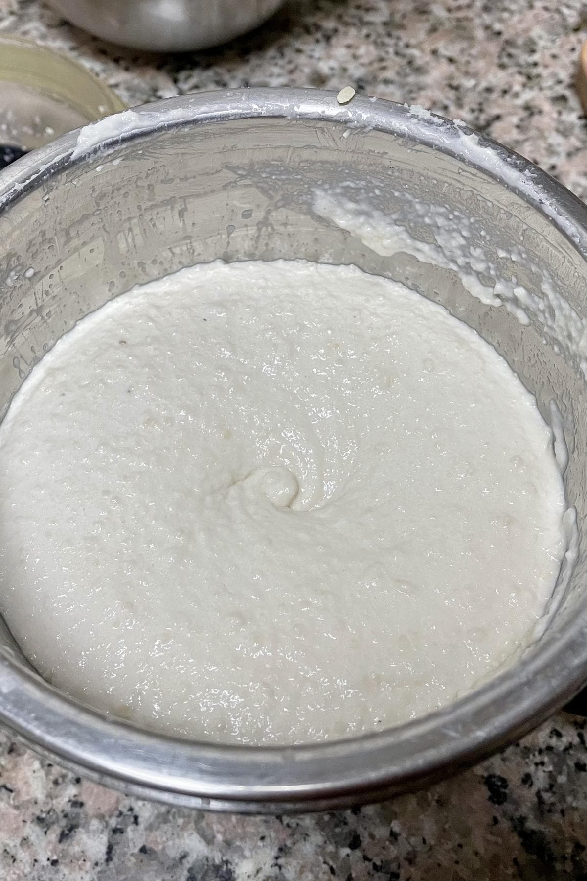 urad dal paste in a grinder.